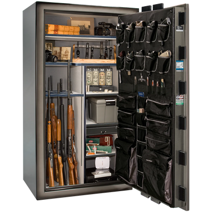 Premium interior of the Liberty Magnum 50 gun safe paired with the Gray Charcoal feathered edge finish, featuring adjustable shelving, door organizer, long gun storage, and deluxe interior configuration.