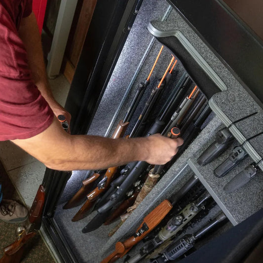 Liberty Orange Rifle Rods organizing scoped rifles inside a Liberty gun safe